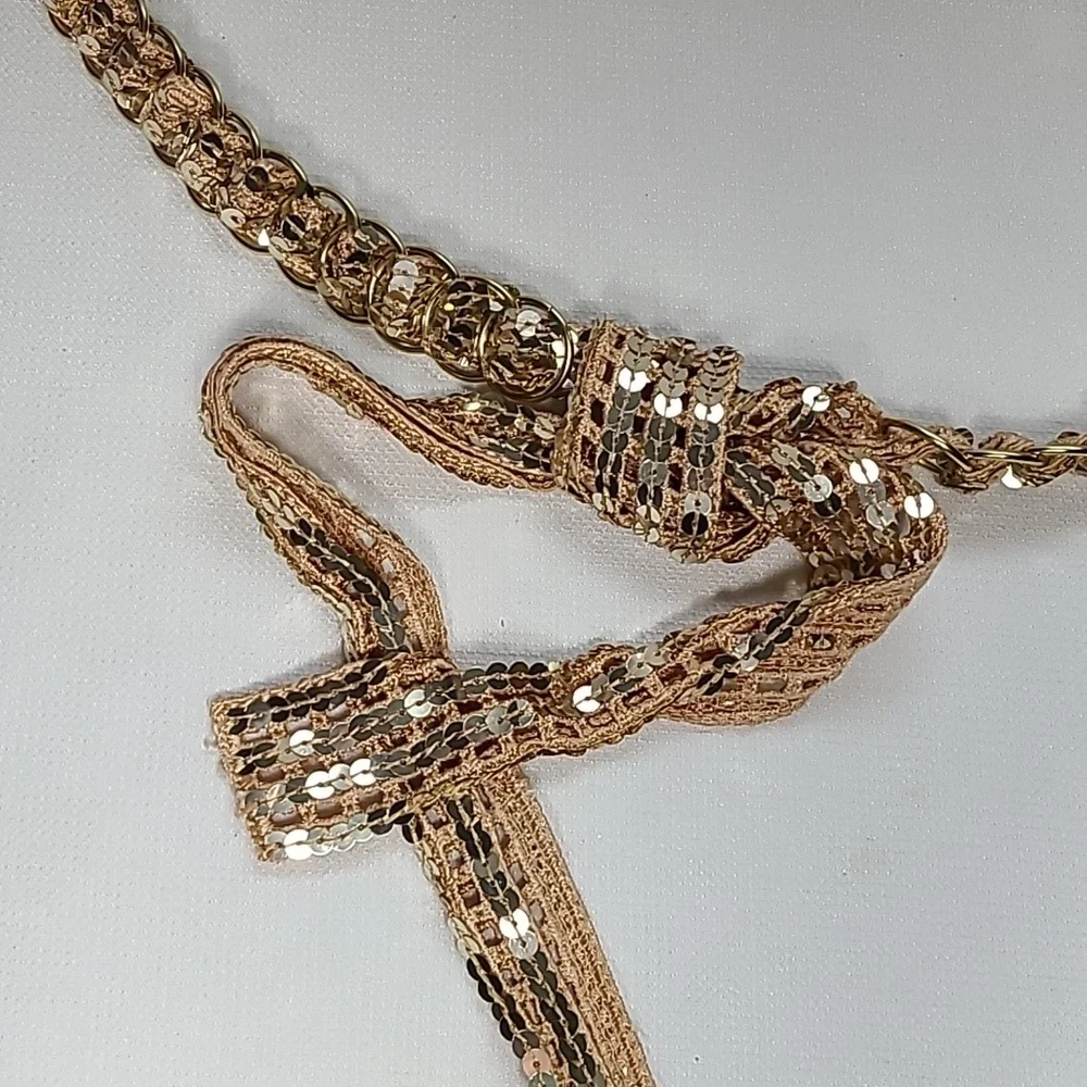Vintage belt, gold rings, open weave fabric, sequins galore!  Glam!!